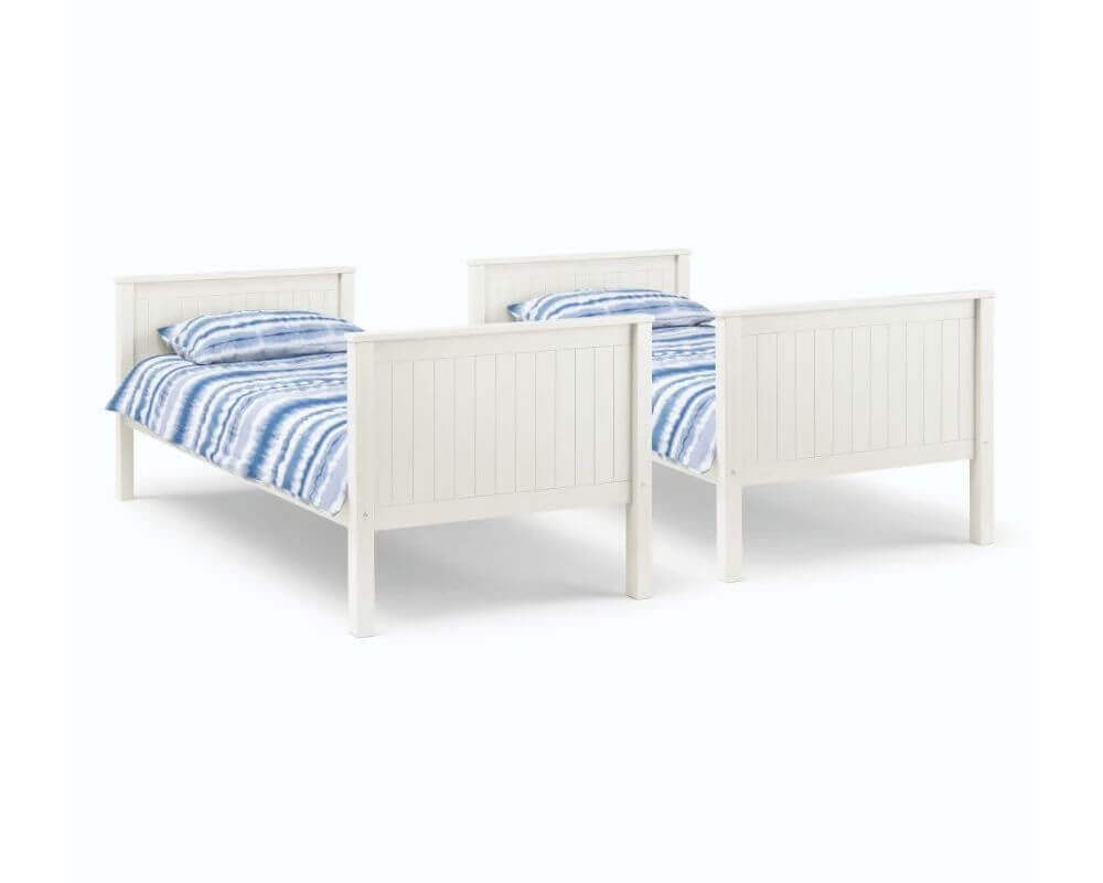 View of white bunk beds parted into two single beds side by side - White background