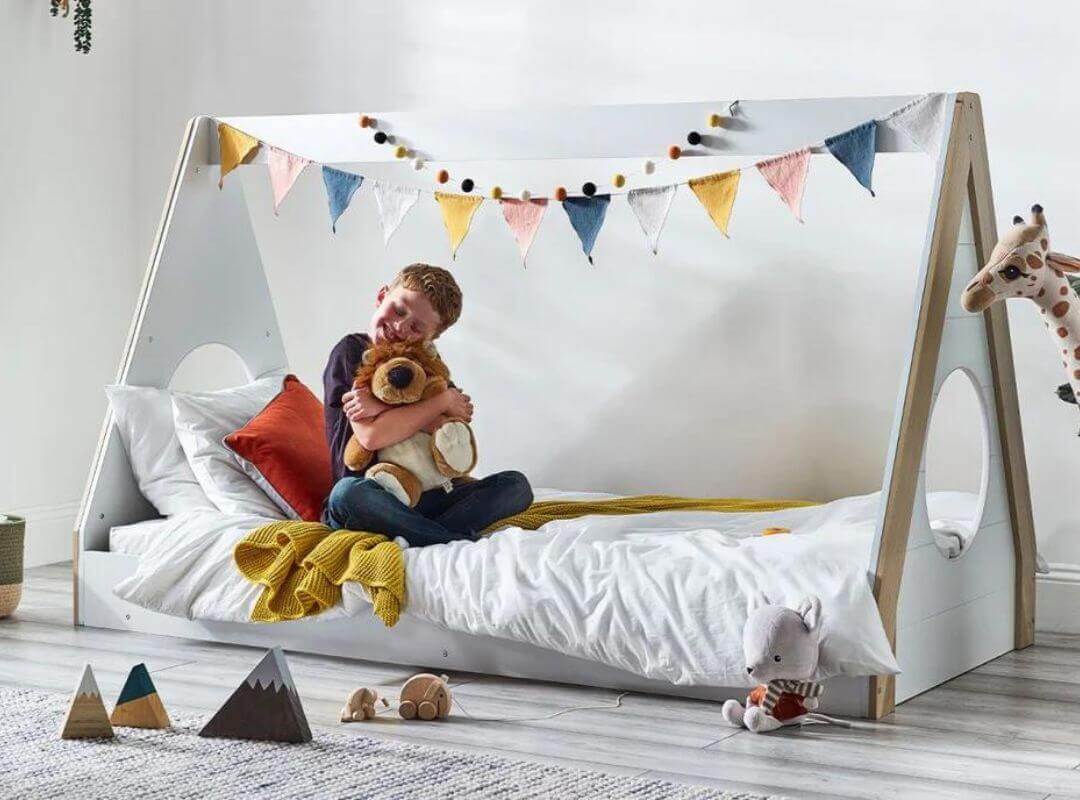 Child playing in a Julian Bowen Festival Tent Bed - Pale Wood & White - Bedroom Setting