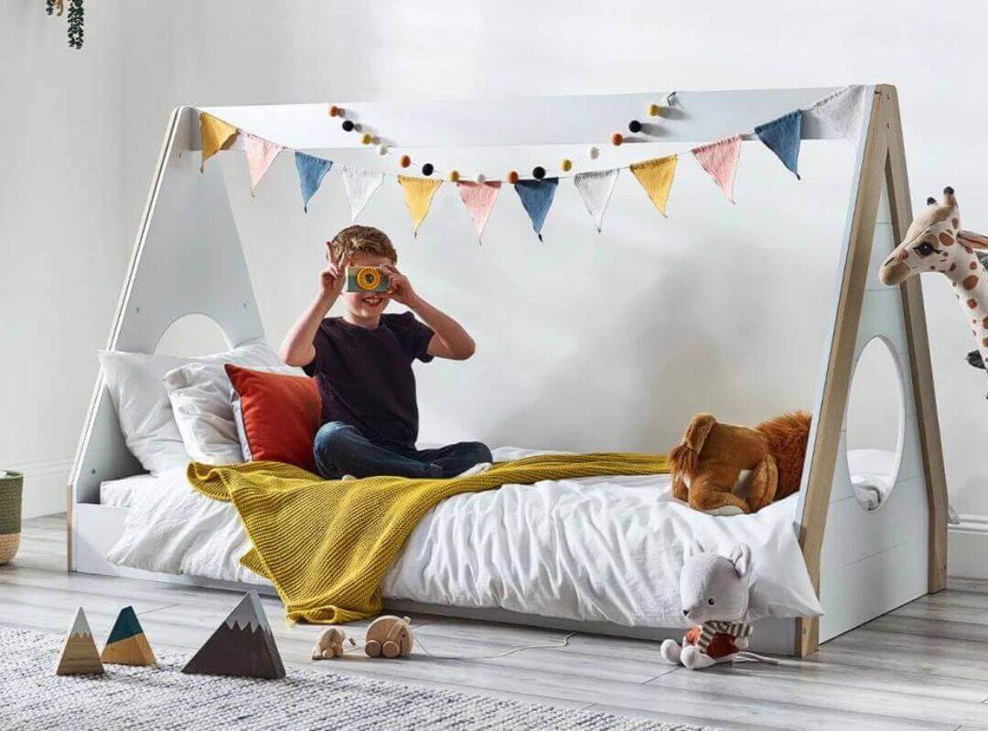 Child playing in a Julian Bowen Festival Tent Bed - Pale Wood & White - Bedroom Setting